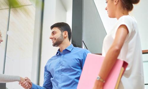 Business Entrepreneurship Bachelor Degree Program Graduate Shaking Hands with Operations Manager 