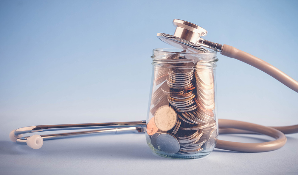 Jar of change with stethoscope wrapped around