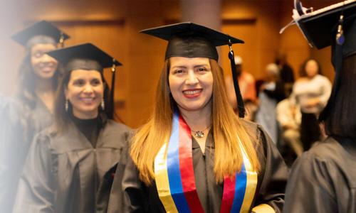 Herzing Iowa Online BSN Student Smiling at Graduation Ceremony 