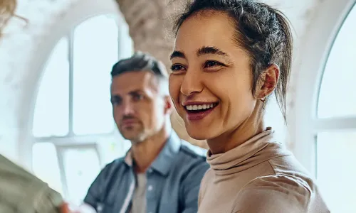 Health and Human Services Worker Smiling at Patient with Hand on Shoulder