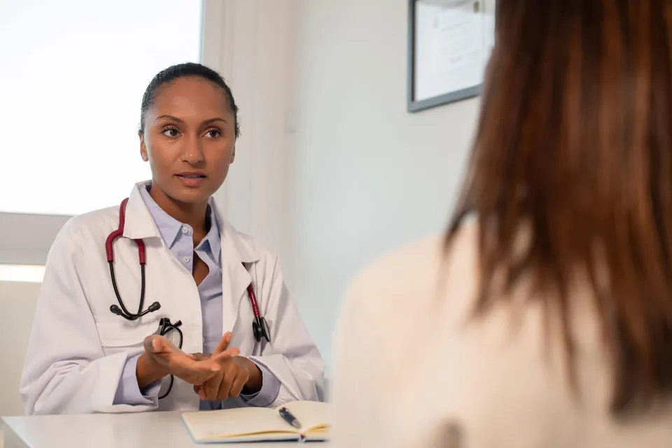 Nurse Practitioner Explaining Treatment Options to Patient