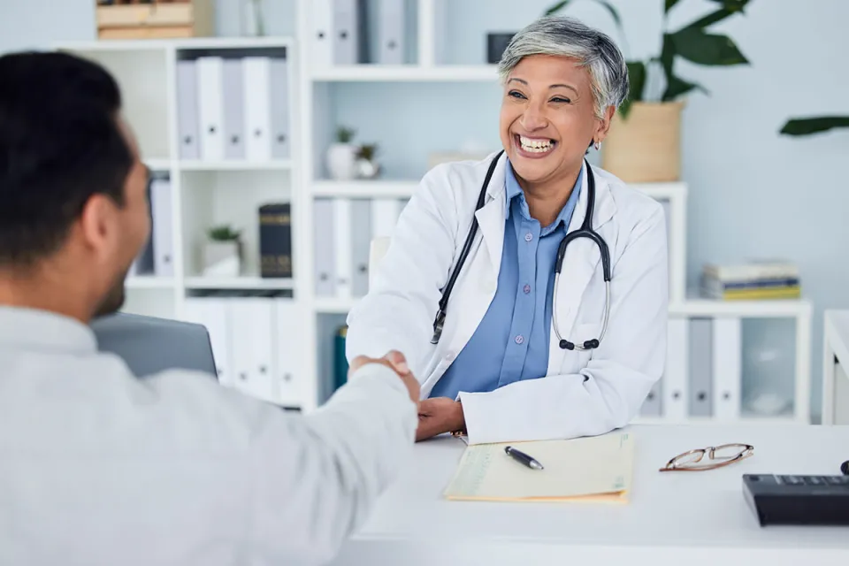 Public Health Nurse Shaking Hands with Nurse Manager