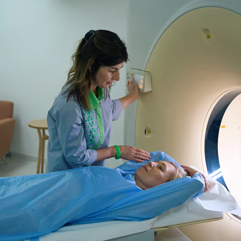 Rad tech guiding patient through X-ray procedure