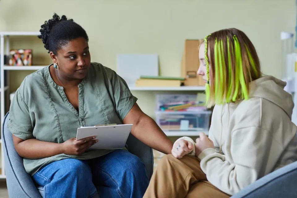 Social Worker Speaking with Young Client