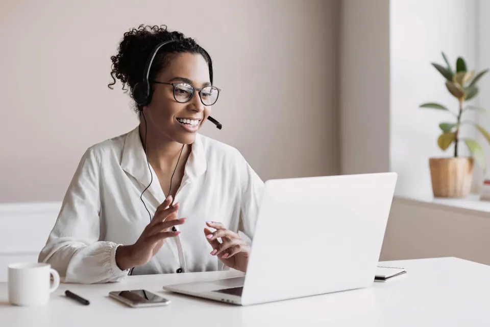 Smiling Medical Coder on Phone Call with Healthcare Staff